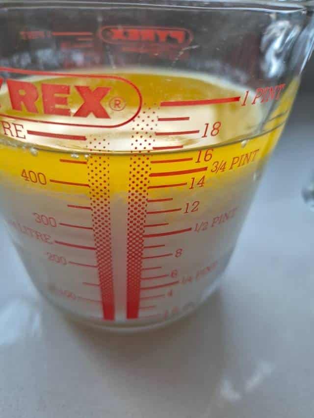 Milk, cream, and melted butter in a measuring jug.