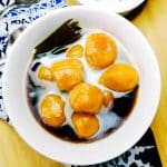 Kolak biji salak in white bowl.