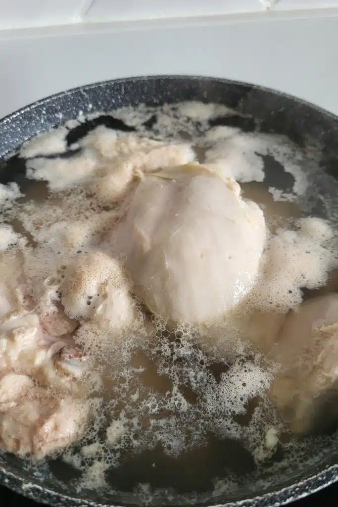 chicken in boiling water.