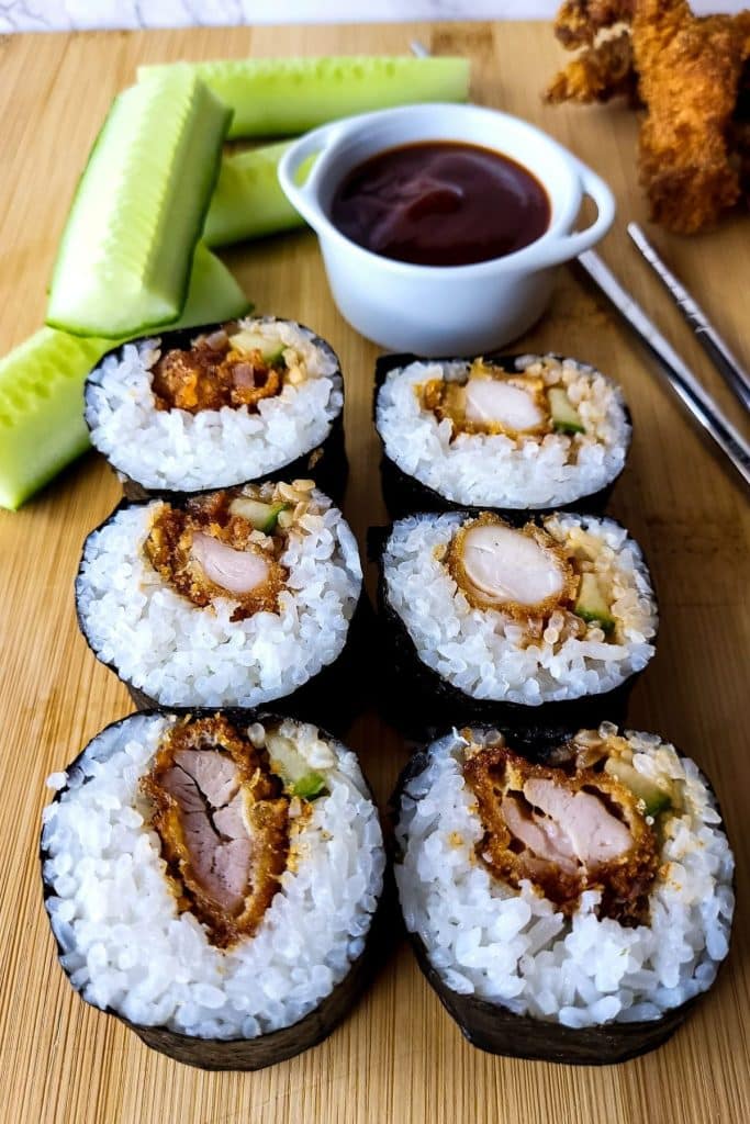 6 Pieces of sushi rolls filled with chicken katsu and cucumber.