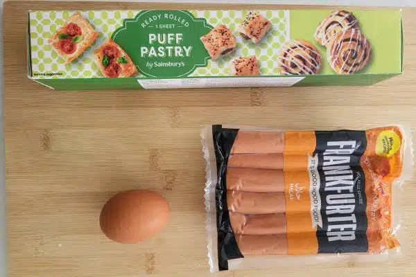 Basic ingredients to make puff pastry sausage rolls.