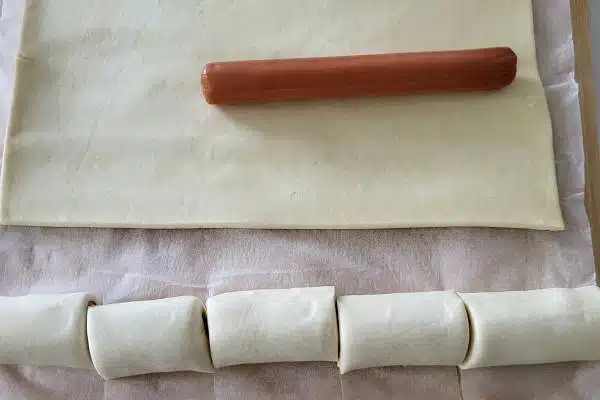 Frankfurter sausage on a puff pastry.