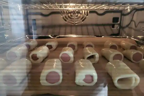 puff pastry sausage rolls in the oven.