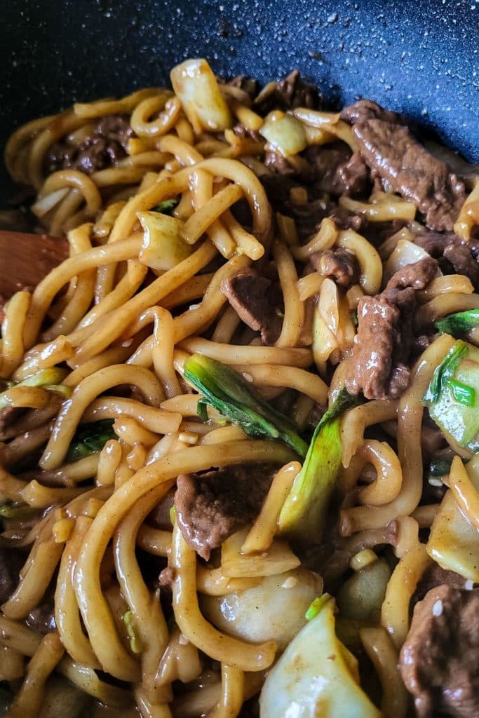 Stir fried udon noodles with beef and pak choi.